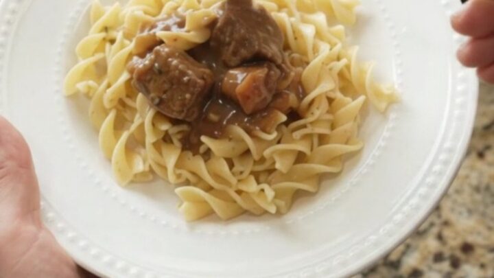 Slow cooker beef stroganoff with carrots and potatoes in a creamy gravy