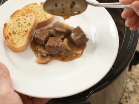 Creamy Gruyère and cream cheese beef bites with portobello mushrooms and shallots in a slow cooker
