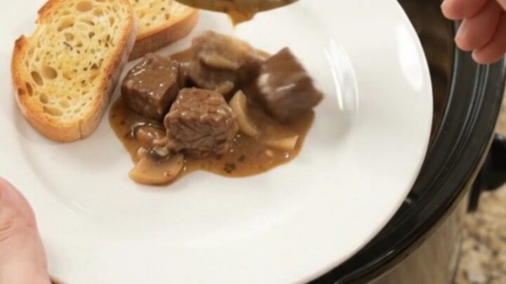 Creamy Gruyère and cream cheese beef bites with portobello mushrooms and shallots in a slow cooker