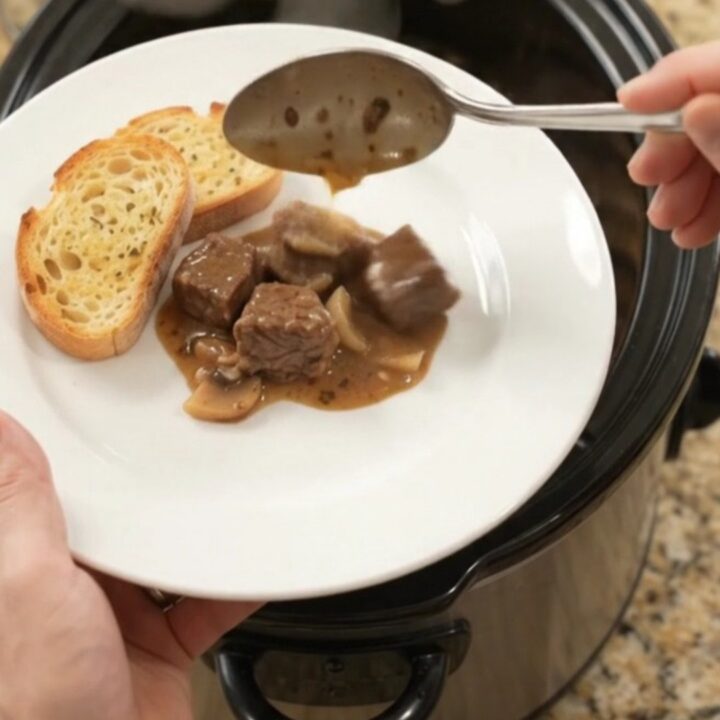 Creamy Gruyère and cream cheese beef bites with portobello mushrooms and shallots in a slow cooker