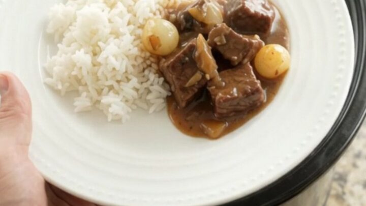 Slow cooker beef with pearl onions and carrots in bourbon gravy
