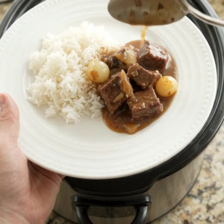 Slow cooker beef with pearl onions and carrots in bourbon gravy