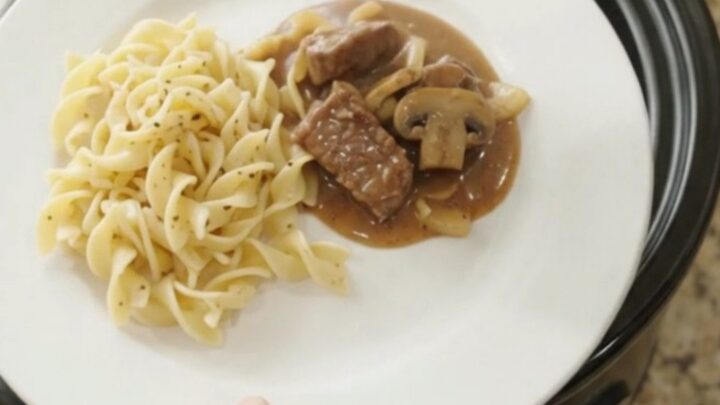 Slow cooker sirloin tips in a creamy mushroom gravy, served over buttered egg noodles.