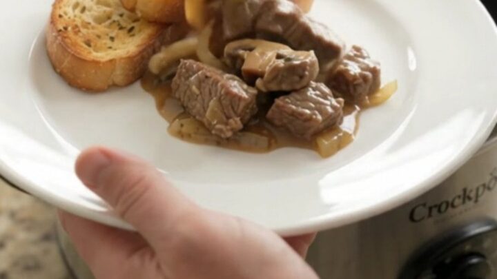 Slow cooker sirloin tips in creamy Gruyère mushroom sauce, bubbling in the Crockpot