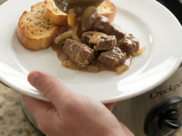 Slow cooker sirloin tips in creamy Gruyère mushroom sauce, bubbling in the Crockpot