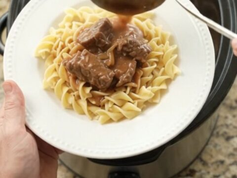 Slow cooker filled with tender sirloin tips in a rich sour cream French onion gravy