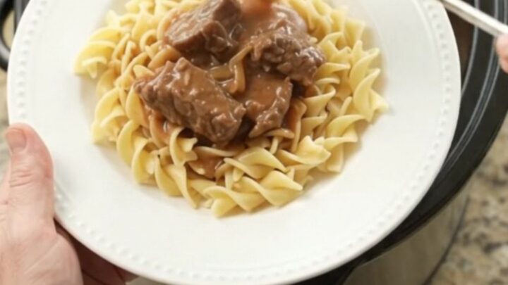 Slow cooker filled with tender sirloin tips in a rich sour cream French onion gravy