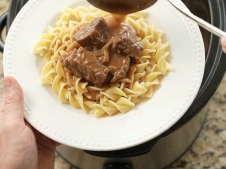 Slow cooker filled with tender sirloin tips in a rich sour cream French onion gravy