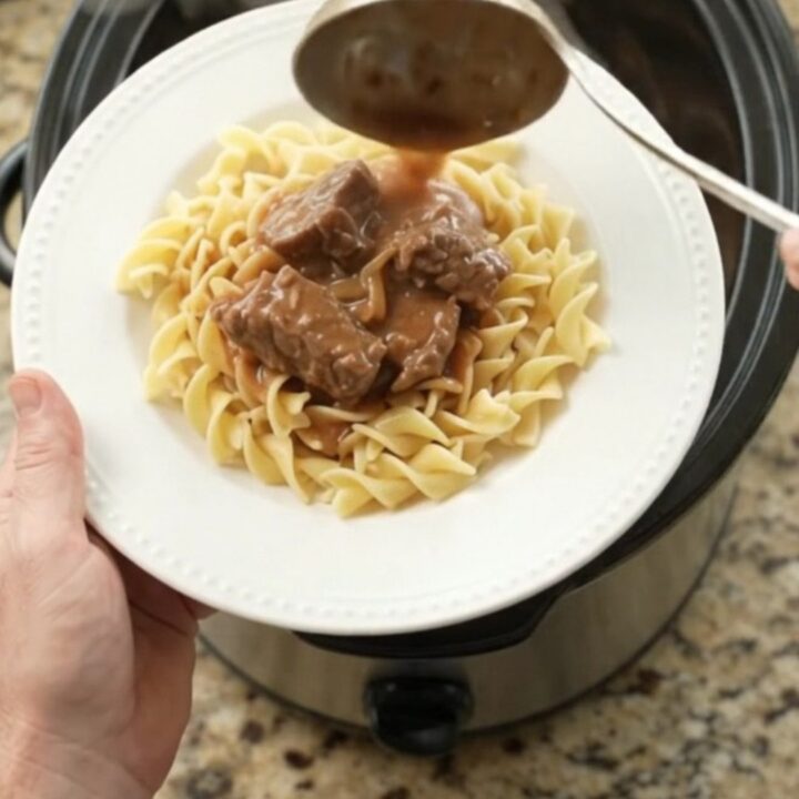 Slow cooker filled with tender sirloin tips in a rich sour cream French onion gravy