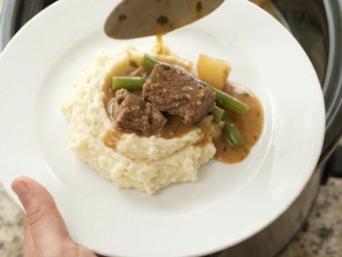 Slow cooker sirloin tips with green beans and potatoes in a rich garlic-herb butter sauce