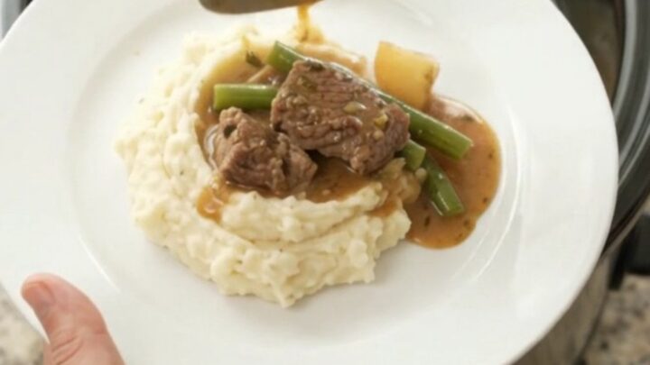 Slow cooker sirloin tips with green beans and potatoes in a rich garlic-herb butter sauce