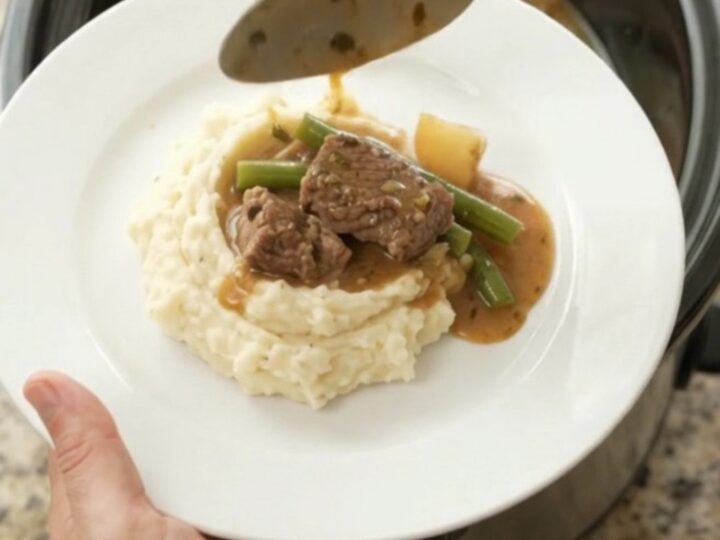 Slow cooker sirloin tips with green beans and potatoes in a rich garlic-herb butter sauce