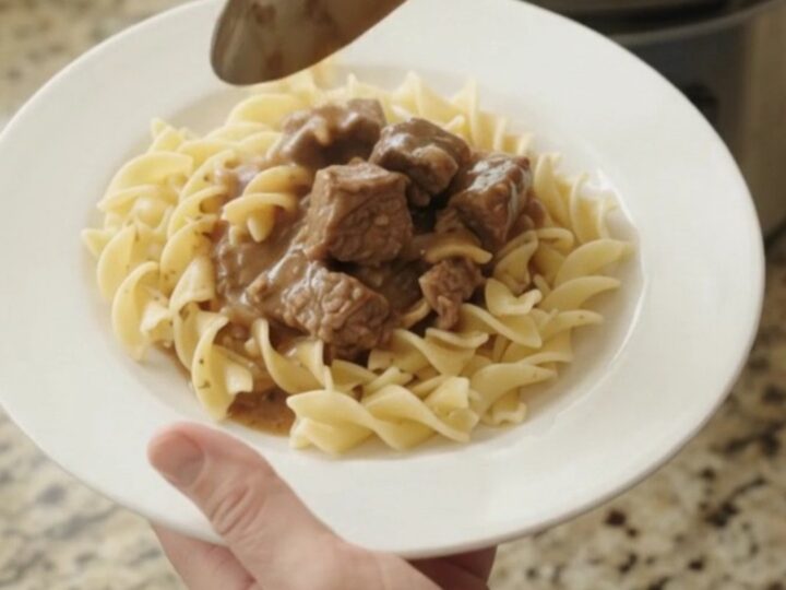 Slow cooker sirloin tips with portobello mushrooms in sour cream gravy, garnished with parsley
