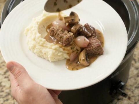 Slow-cooked sirloin tips and portobello mushrooms in a garlic-butter au jus, served over mashed potatoes