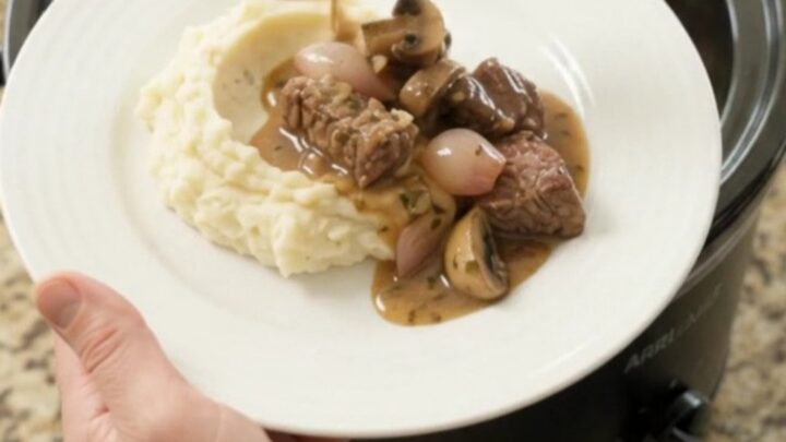 Slow-cooked sirloin tips and portobello mushrooms in a garlic-butter au jus, served over mashed potatoes
