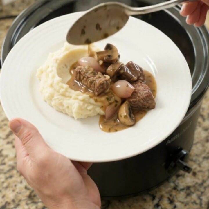 Slow-cooked sirloin tips and portobello mushrooms in a garlic-butter au jus, served over mashed potatoes