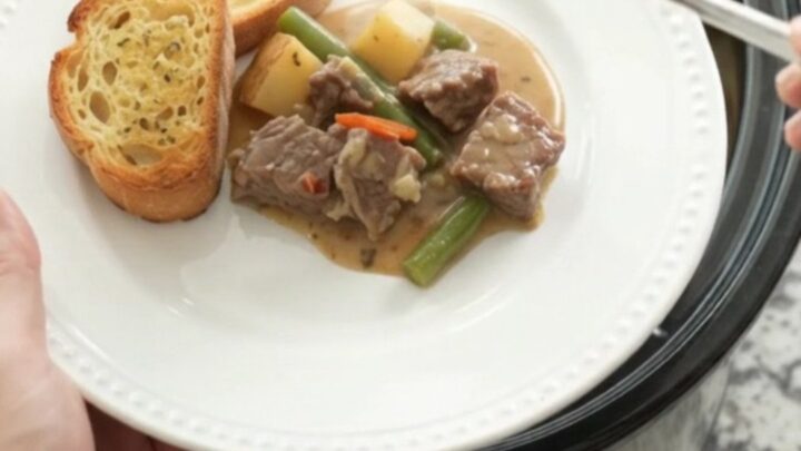 Slow cooker sirloin tips with green beans and potatoes in a creamy Gruyère sauce