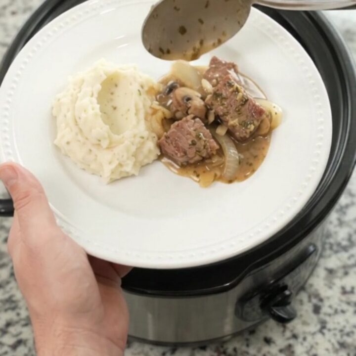 Slow cooker cowboy butter ribeye bites with mushrooms and onions in a rich sauce
