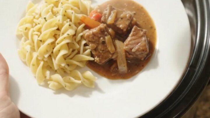 Slow cooker ribeye bites with bell peppers and onions in a rich sour cream gravy