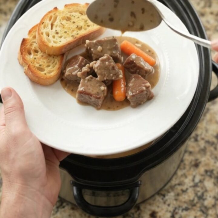 Slow cooker ribeye bites with carrots and potatoes in a creamy Gruyère sauce
