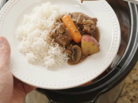 Slow cooker ribeye bites with carrots and potatoes in bourbon gravy