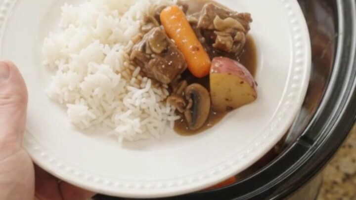 Slow cooker ribeye bites with carrots and potatoes in bourbon gravy