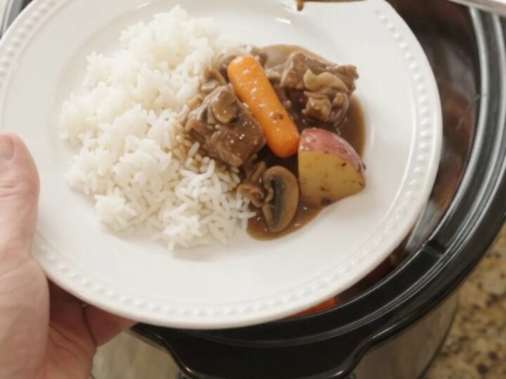 Slow cooker ribeye bites with carrots and potatoes in bourbon gravy