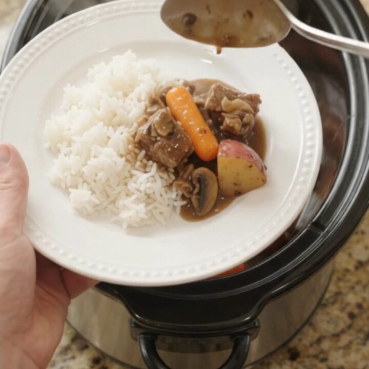 Slow cooker ribeye bites with carrots and potatoes in bourbon gravy