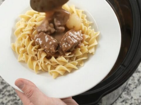 Slow cooker ribeye bites with pearl onions and carrots in creamy gravy