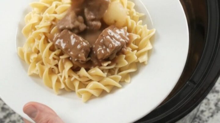 Slow cooker ribeye bites with pearl onions and carrots in creamy gravy