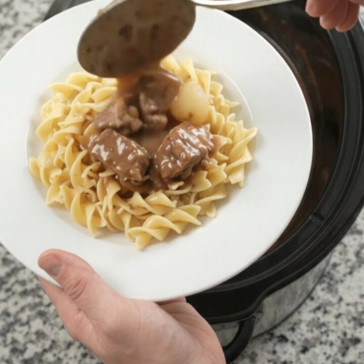 Slow cooker ribeye bites with pearl onions and carrots in creamy gravy