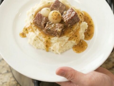 Slow cooker ribeye bites with pearl onions and carrots in buttery au jus