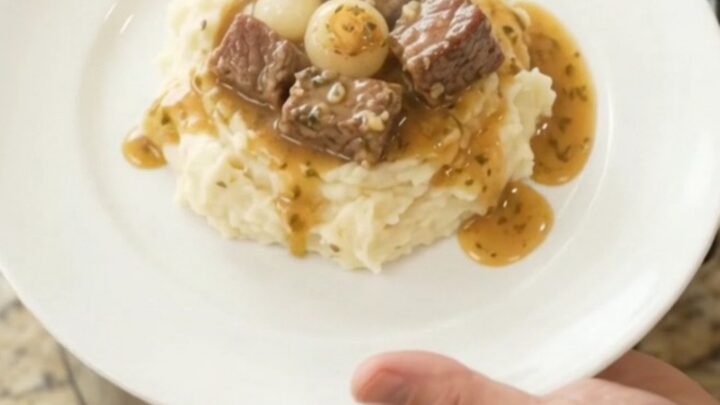Slow cooker ribeye bites with pearl onions and carrots in buttery au jus