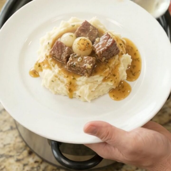 Slow cooker ribeye bites with pearl onions and carrots in buttery au jus
