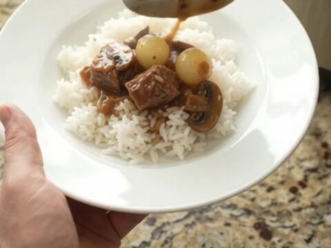Slow cooker ribeye bites in bourbon gravy with pearl onions and carrots