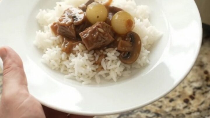 Slow cooker ribeye bites in bourbon gravy with pearl onions and carrots