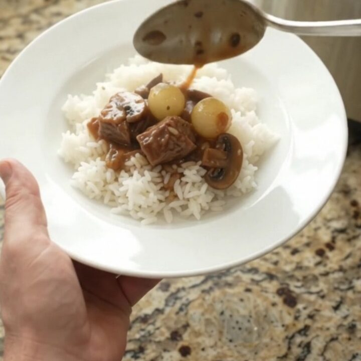 Slow cooker ribeye bites in bourbon gravy with pearl onions and carrots