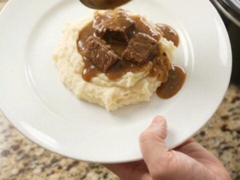 Slow cooker ribeye bites and potatoes in a glossy butter sauce