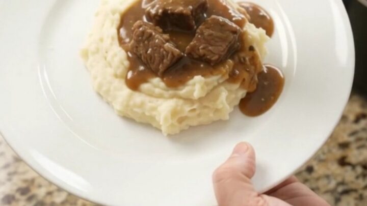 Slow cooker ribeye bites and potatoes in a glossy butter sauce