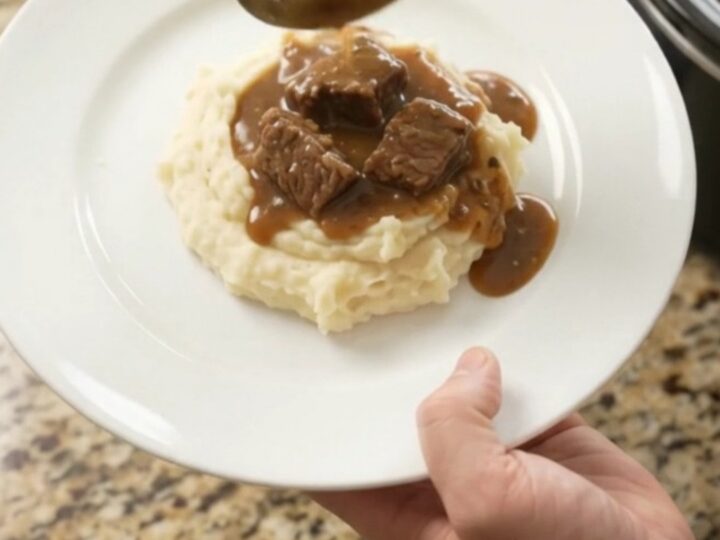 Slow cooker ribeye bites and potatoes in a glossy butter sauce