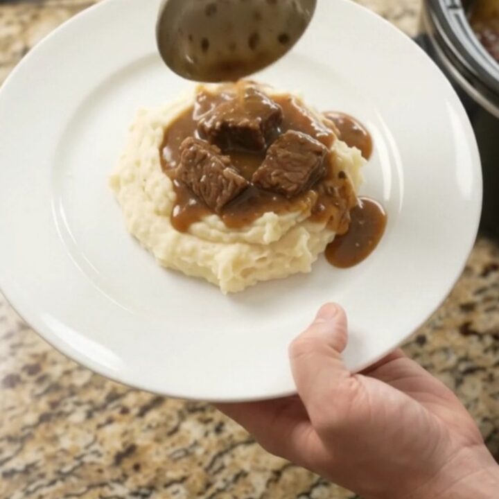 Slow cooker ribeye bites and potatoes in a glossy butter sauce