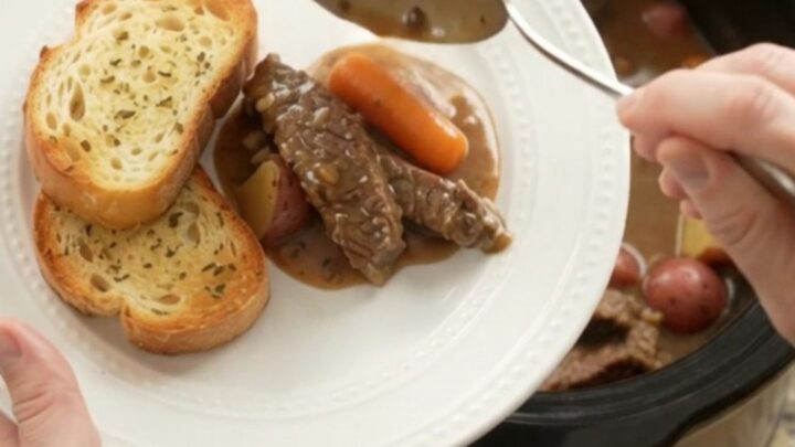 Slow cooker flank steak with carrots and potatoes in a creamy Gruyère sauce