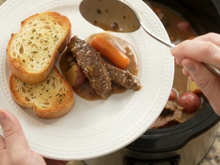 Slow cooker flank steak with carrots and potatoes in a creamy Gruyère sauce