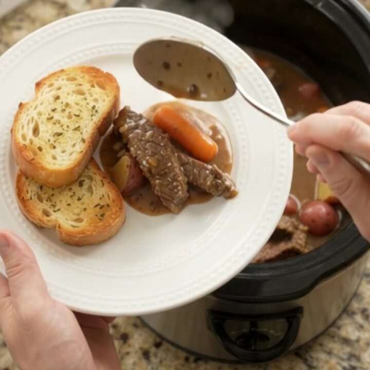 Slow cooker flank steak with carrots and potatoes in a creamy Gruyère sauce