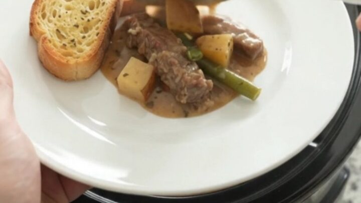 Slow cooker flank steak with green beans and potatoes in creamy Gruyère sauce