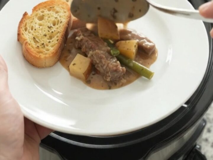 Slow cooker flank steak with green beans and potatoes in creamy Gruyère sauce