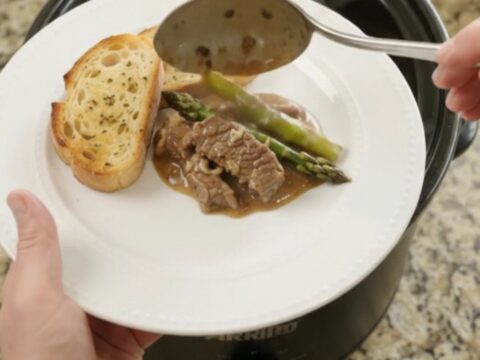 Slow cooker flank steak and asparagus in creamy Gruyère sauce