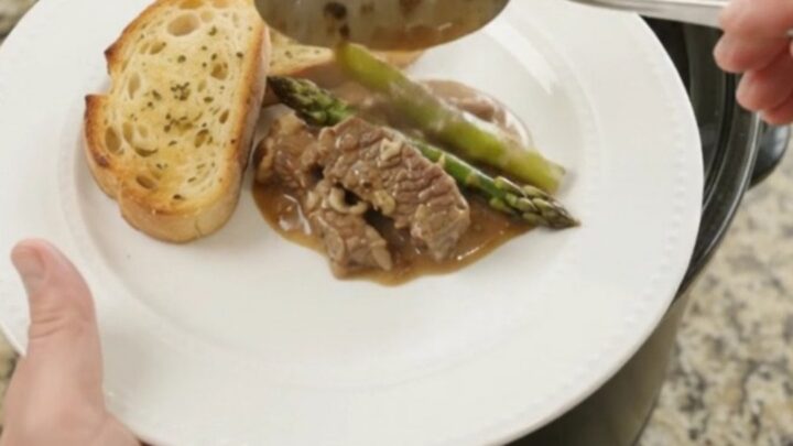 Slow cooker flank steak and asparagus in creamy Gruyère sauce
