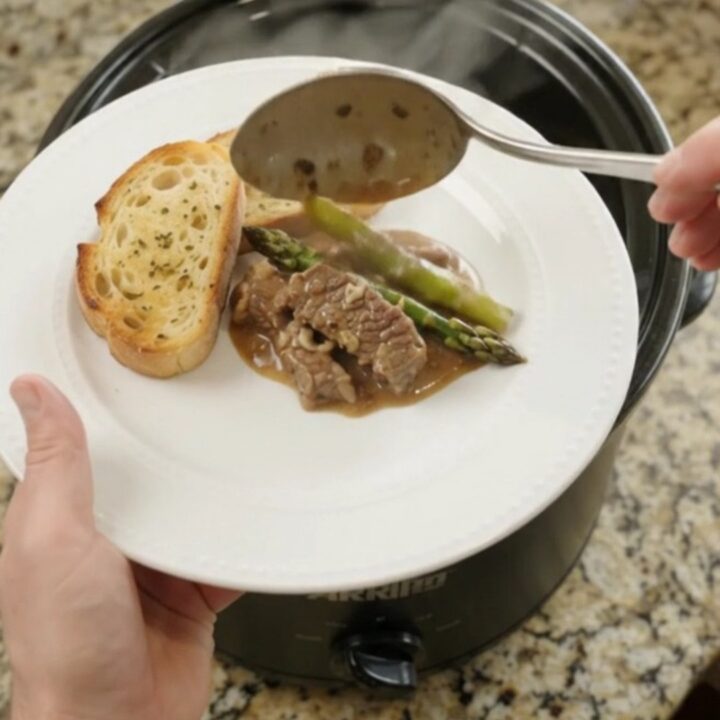 Slow cooker flank steak and asparagus in creamy Gruyère sauce