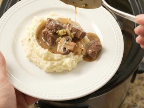 Slow cooker beef tenderloin tips with broccoli and mushrooms in a rich au jus sauce.